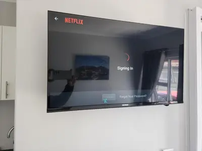 a flat screen tv hanging on a wall at Wagenaar Villas in Monte Vista