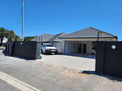a house with a car parked in a driveway at Wagenaar Villas in Monte Vista