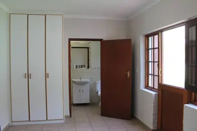 a bathroom with a toilet and a sink at Firlands Farmhouse 179A with a view in Sir Lowry Pass