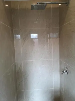 a bathroom with a shower with a glass door at Coastal Cozy 2 in Cape Town