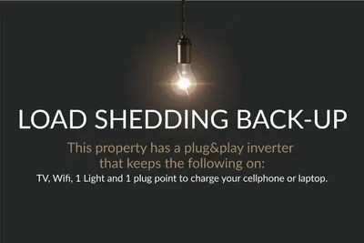 a load shedding back up poster with a light bulb at Horizon Bay 1603 by HMH in Cape Town