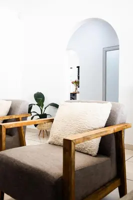 a living room with a couch and a table at Spacious beachfront Townhouse w garage, Blouberg in Bloubergstrand
