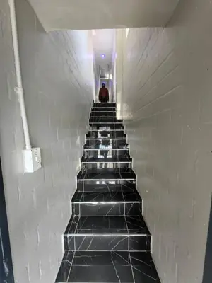 a man standing at the top of a stair case at Essential Lodge23 in Cape Town