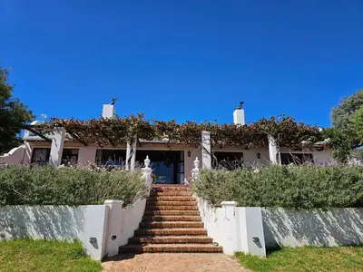 a house with stairs leading up to it at Valley View Eco Country Estate - Paradise in the Winelands in Villiersdorp