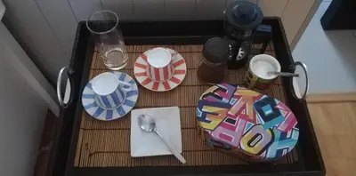 a table with plates and utensils on top of it at Durbanville Luxury Living Private Room in Durbanville