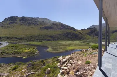 a view of a river from the side of a mountain at Hytte Riverview in Rooiels