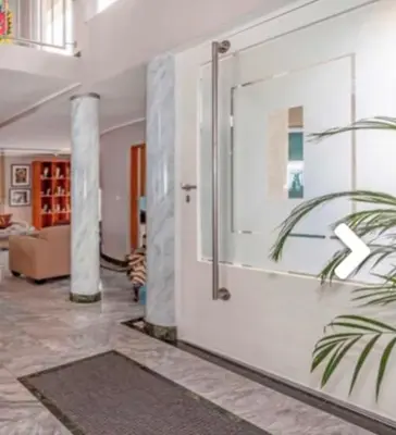 a room with a door with a plant in it at Villa Georgia in Cape Town