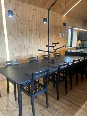a black table and chairs in a room at Old Mac Daddy in Botrivier