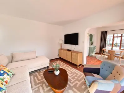 a living room with a couch and a table at 2 Barford Haven in Hermanus