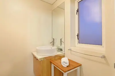 a bathroom with a sink and a mirror at Horizon Bay 1201 in Bloubergstrand