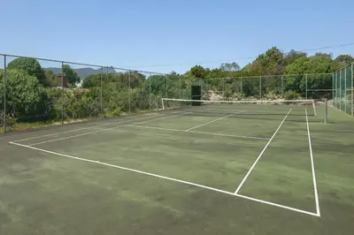 a tennis court with two tennis nets on it at The Blue Cabin in Fisherhaven