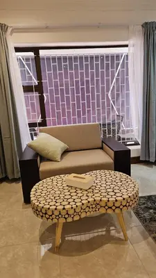 a living room with a couch and a coffee table at Suikerbos Guesthouse in Cape Town