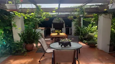 a patio with a table with an elephant statue on it at Linge Longa in Worcester