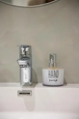 two soap dispensers sitting on a counter in a bathroom at 505 La Roche, Paarl in Paarl
