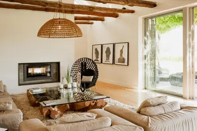 a living room with a couch and a table at MAISON FRANSCHHOEK in Franschhoek