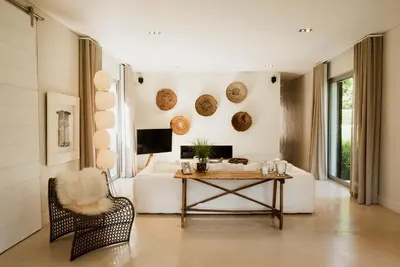 a living room with a white couch and a table at MAISON FRANSCHHOEK in Franschhoek