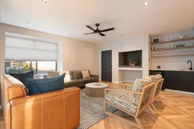 a living room with a couch and a table at Villa Paradys - Serviced in Stellenbosch