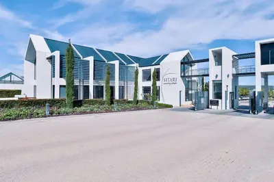 a large white building with a street in front of it at Sitari County Estate - The Most Iconic Estate in Cape Town