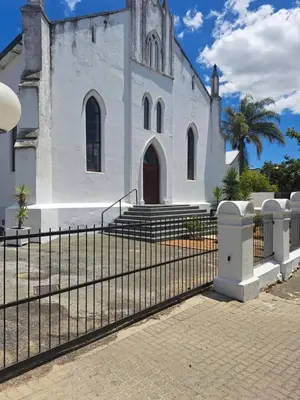 a church with a fence in front of it at The Stetson - Paarl - Self Catering Apartment in Paarl
