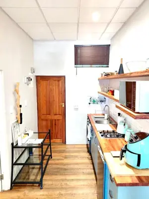 a kitchen with a sink and a counter top at The Stetson - Paarl - Self Catering Apartment in Paarl
