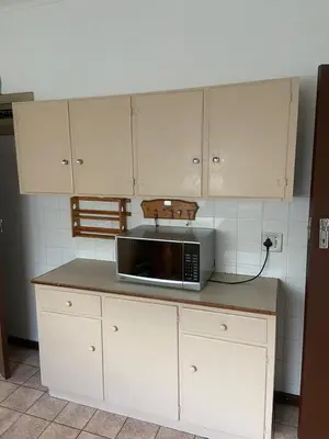 a microwave sitting on a counter in a kitchen at A cosy home in Hermanus in Hermanus