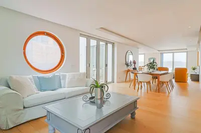 a living room with a couch and a table at 91 Atlantic Drive in Hermanus