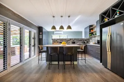 a kitchen with a large table and chairs at Florie se Huis in Paarl