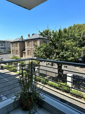 a view of a building from a balcony at Cozy Rondebosch Apartment in Cape Town