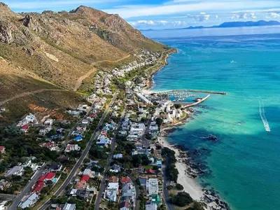 an aerial view of a town next to the ocean at 'Seagul Cove', Private Villa on the beach, Sleeps 7 in Cape Town