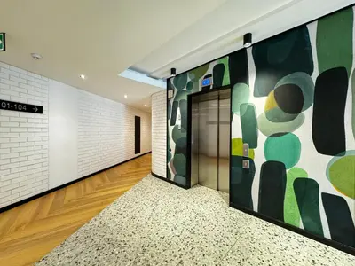 a hallway with a large painting on the wall at S.A.E. Nine Palms Luxury in Cape Town