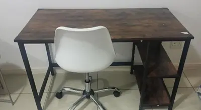 a white chair sitting at a wooden desk at The Sandown Blouberg self catering unit in Parklands
