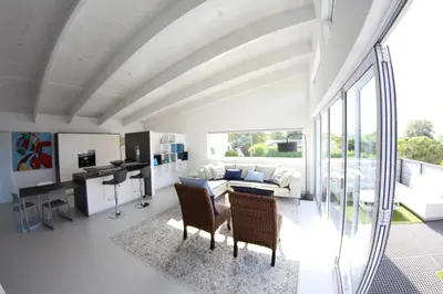 a large living room with a table and chairs at 116m² SeaView TopLuxury Apart, Bay & Mountain View in Somerset West