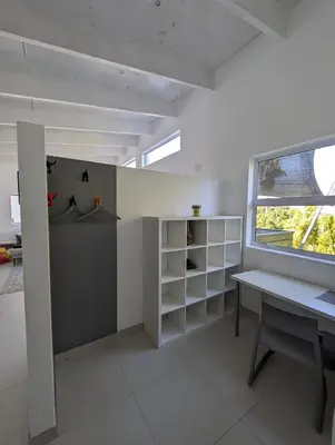 a white room with a desk and a window at 116m² SeaView TopLuxury Apart, Bay & Mountain View in Somerset West