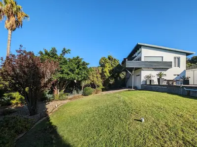 a house with a large yard in front of it at 116m² SeaView TopLuxury Apart, Bay & Mountain View in Somerset West