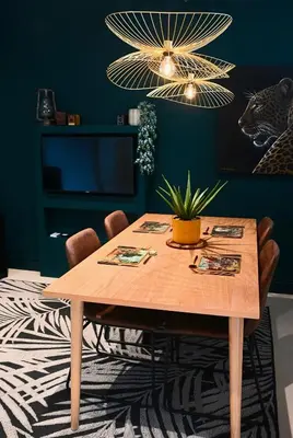 a dining room with a wooden table with chairs at Luxery Gem in Stellenbosch in Stellenbosch