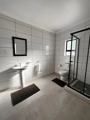 a bathroom with a sink and a toilet at 2nd on Strand in Cape Town