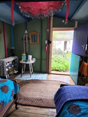 a bedroom with a room with a bed and a window at Gypsy Mama in Greyton in Greyton