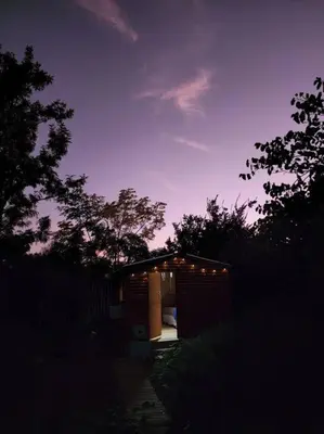a small building with lights on it at night at Gypsy Mama in Greyton in Greyton