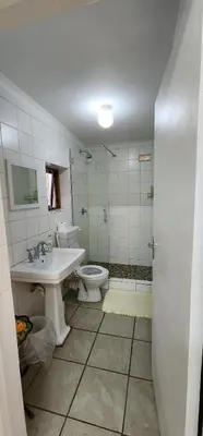 a bathroom with a sink and a toilet and a shower at Sundance in Central Greyton in Greyton