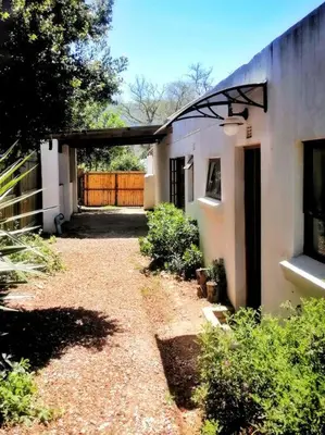 a house with a driveway leading to a garage at Sundance in Central Greyton in Greyton