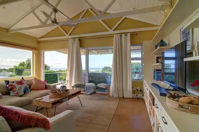 a living room with a couch and a table at Dieu Donne in Hermanus