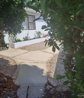 a walkway in front of a house at Watercolour Cottage in Hermanus