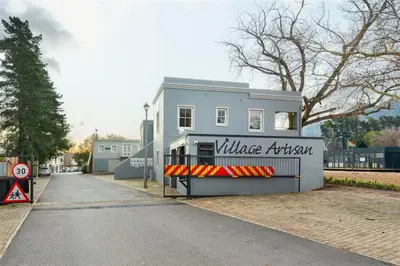a building with a sign that reads village kitchen at Franschhoek Colours in Franschhoek