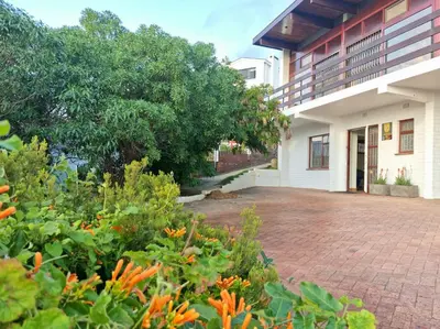 a brick patio in front of a building at Loft Cottage, sleeps 2. Central and Cozy! in Cape Town