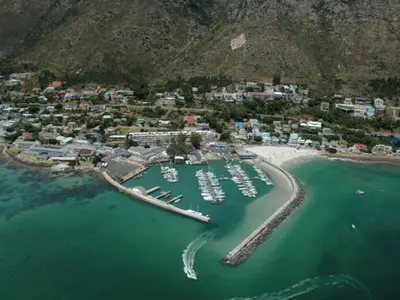 an aerial view of a harbor with boats in the water at Beach Apartment on Bikini Beach - sleeps 4 in 2 Ensuite Bedrooms in Cape Town