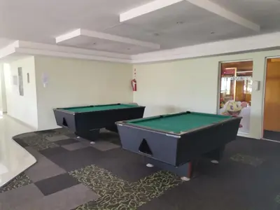 two pool tables sitting in a room with at Simplicity with an ocean view 200 in Hermanus