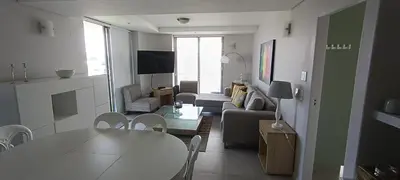 a living room with a couch and a table at 502 Hibernian Towers in Cape Town