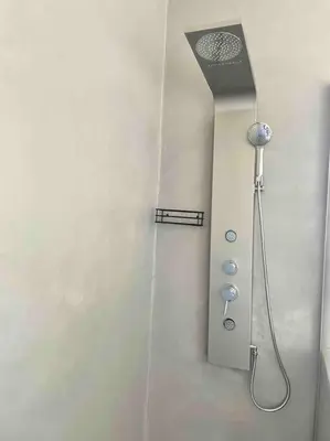 a shower head on a wall in a bathroom at Franschhoek - A Sensory Escape in Franschhoek