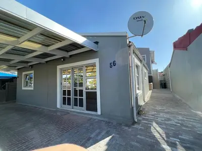 a side view of a building with a garage at The MK House in Cape Town