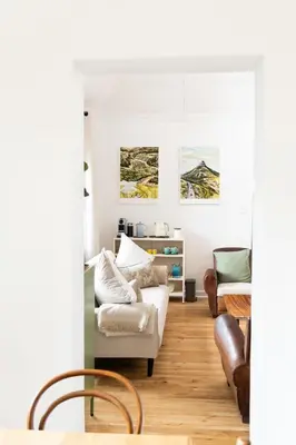 a living room with a couch and a table at Boho Chic Studio Stellenbosch in Stellenbosch